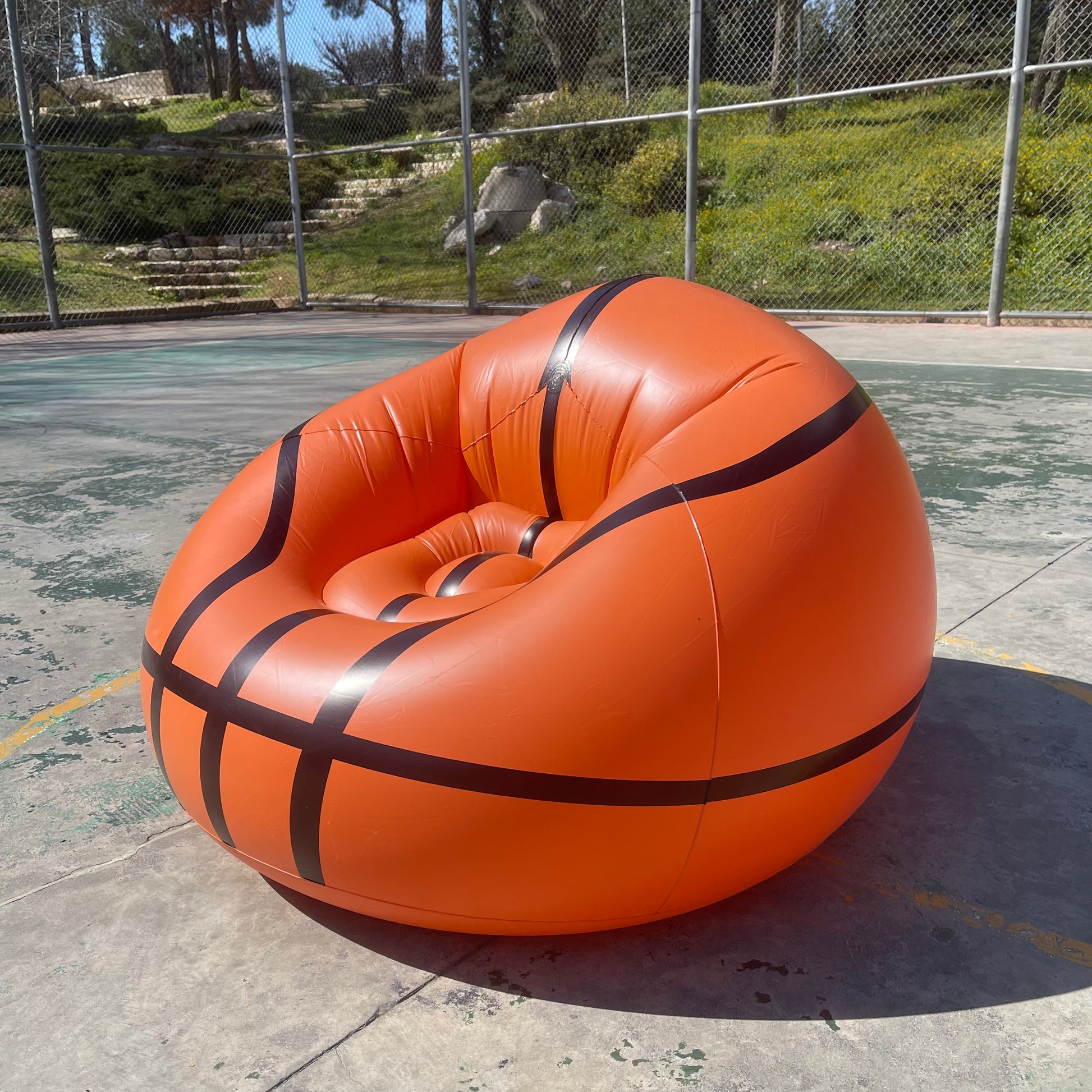 an Inflatable Basketball Sofa, in court side